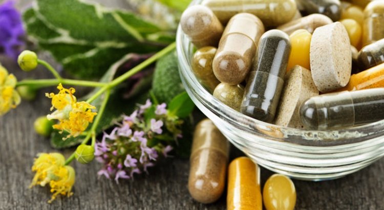 Natural supplement capsules with herbs